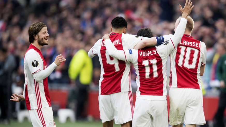epa05942423 Ajax Amsterdam player Amin Younes (2-R) celebrates with his teammates after scoring the 3-0 goal during the UEFA Europa League semi final, first leg soccer match between Ajax Amsterdam and ...