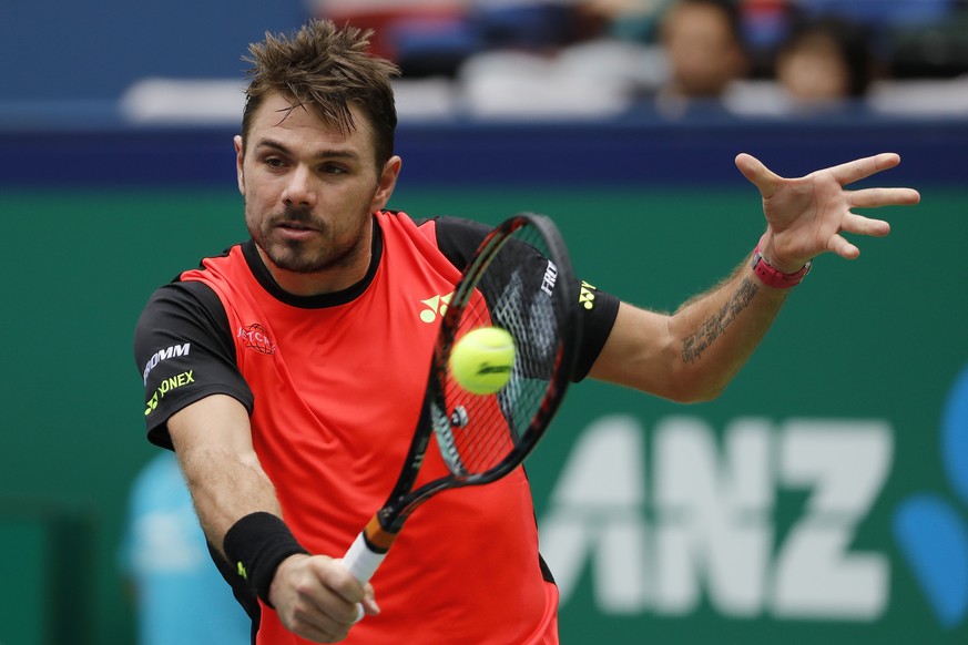 Stan Wawrinka of Switzerland hits a return shot against Kyle Edmund of Britain during the men&#039;s singles match of the Shanghai Masters tennis tournament at Qizhong Forest Sports City Tennis Center ...