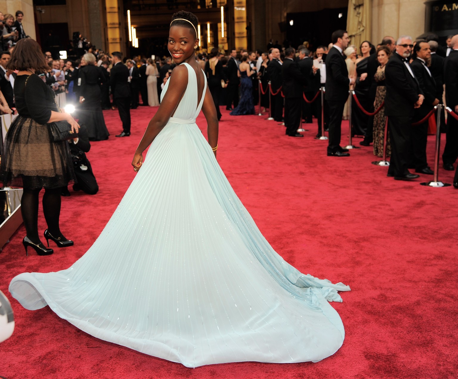 Lupita Nyong&#039;o arrives at the Oscars on Sunday, March 2, 2014, at the Dolby Theatre in Los Angeles. (Photo by Chris Pizzello/Invision/AP)
