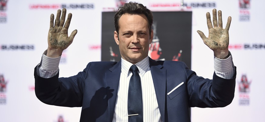 Vince Vaughn shows his hands during his handprint and footprint ceremony at the TCL Chinese Theatre IMAX on Wednesday, March 4, 2015, in Los Angeles. (Photo by Chris Pizzello/Invision/AP)