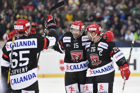 Mountfield Rudolf Cerveny, Blaz Gregorc and Jaroslav Bednar, from left, celebrate after Bednar scored 1-3, during the game between Mountfield HK and Team Canada at the 90th Spengler Cup ice hockey tou ...