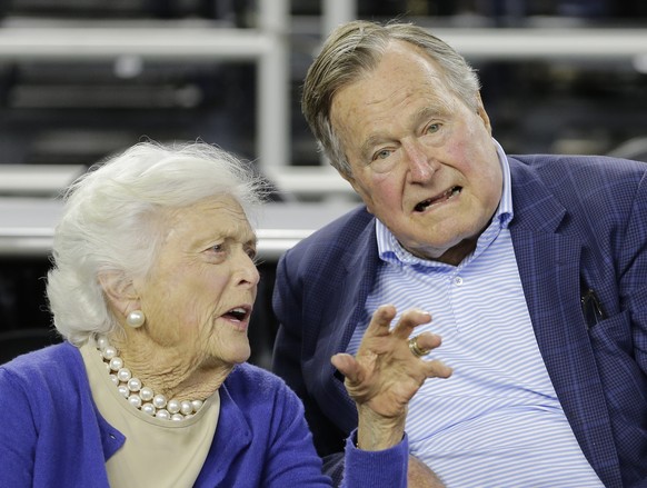 FILE- In this March 29, 2015, file photo, former President George H.W. Bush and his wife Barbara Bush speak before the first half of an NCAAA college basketball game in Houston. A spokesman says docto ...