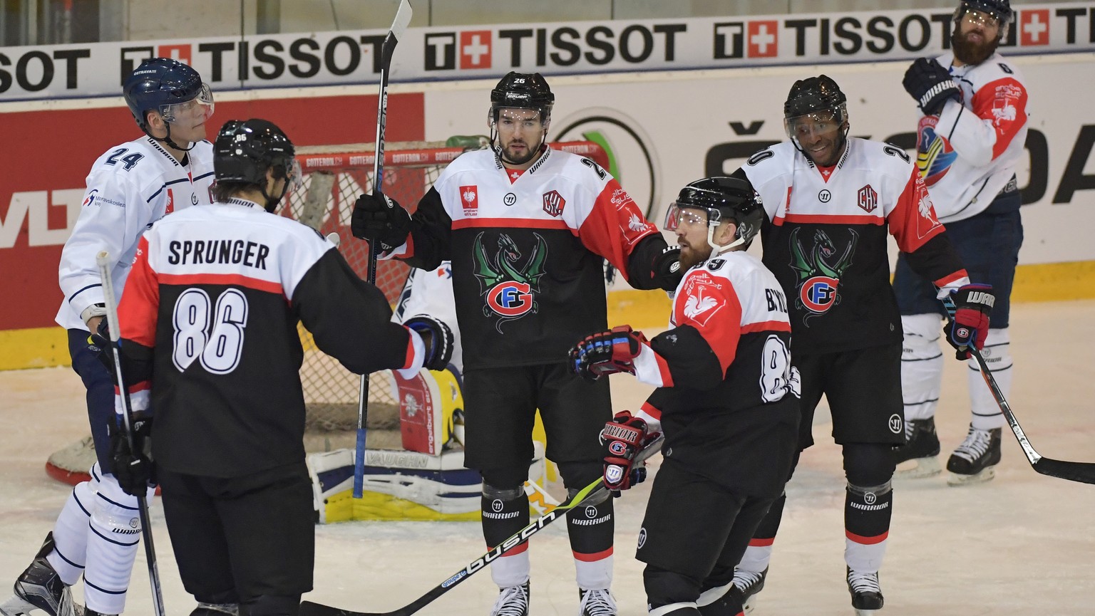 Fribourg&#039;s Greg Mauldin, Andrey Bykov, Michal Birner and Julien Sprunger, from right, celebrate their third Goal during the ice hockey Champions League match 1/4 Final between HC Fribourg-Gottero ...