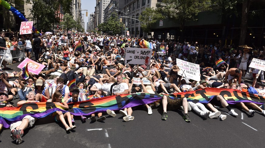 epa05393601 Marchers with a group called &#039;Gays Against Guns&#039; participate in a lie-in during the 46th annual New York City Gay Pride Parade in New York, New York, USA, 26 June 2016. Large cro ...
