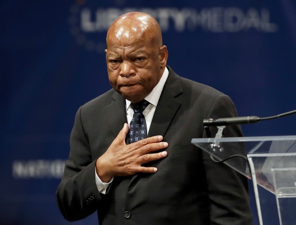 FILE - In this Sept. 19, 2016 file photo, Rep. John Lewis, D-Ga., reacts after being presented with the Liberty Medal for his dedication to civil rights during a ceremony in Philadelphia. Colson White ...