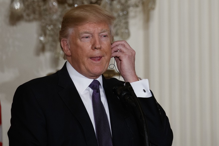 President Donald Trump listens as Canadian Prime Minister Justin Trudeau speaks during a joint news conference in the East Room of the White House, Monday, Feb. 13, 2017, in Washington. (AP Photo/Evan ...