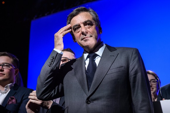 epa05852968 French right-wing party &#039;Les Republicains&#039; candidate for the 2017 French presidential elections, Francois Fillon, reacts after delivering a speech during an election campaign eve ...