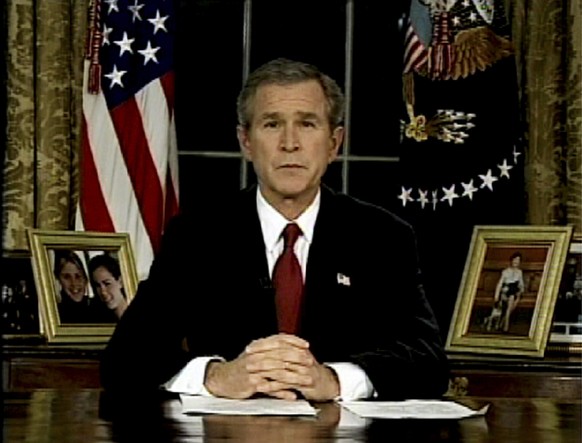 FILE - In this March 19, 2003, file photo, President George W. Bush, seen in this image from television, addresses the nation from the Oval Office at the White House in Washington. Under Bush, the U.S ...