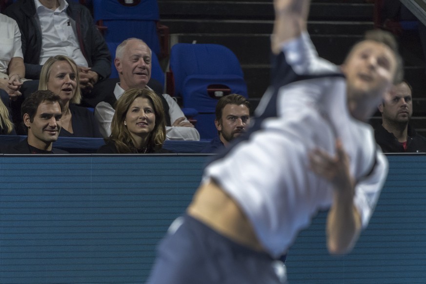 Roger and Mirka Federer are supporting Switzerland&#039;s Marco Chiudinelli during his first round match against Netherlands&#039; Robin Haase at the Swiss Indoors tennis tournament at the St. Jakobsh ...