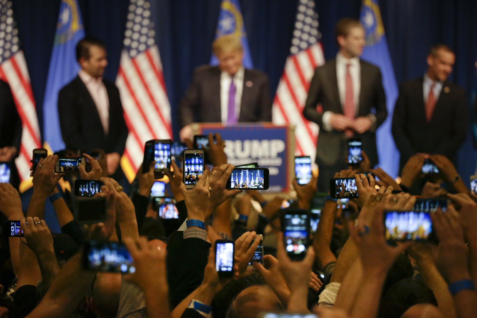Supporters hold up their smartphones to photograph Republican presidential candidate Donald Trump during a caucus night rally Tuesday, Feb. 23, 2016, in Las Vegas. (AP Photo/Jae C. Hong)