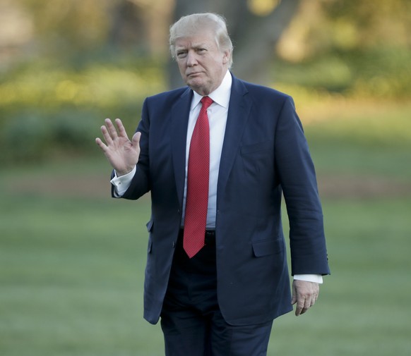 President Donald Trump waves as he walks across the South Lawn of the White House in Washington, Sunday, April 9, 2017. Trump is returning from a trip to his Mar-a-Lago estate in Palm Beach, Fla. (AP  ...