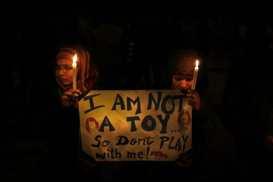 FILE - In this Dec. 30, 2012 photo, Indians hold a candle light vigil to mourn the death of a gang rape victim as urge the government to make several key reforms to ensure safety of women, in New Delh ...