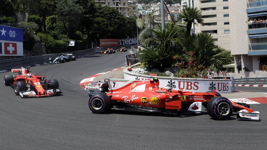 Ferrari driver Kimi Raikkonen of Finland steers his car followed by Ferrari driver Sebastian Vettel of Germany during the Formula One Grand Prix at the Monaco racetrack in Monaco, Sunday, May 28, 2017 ...