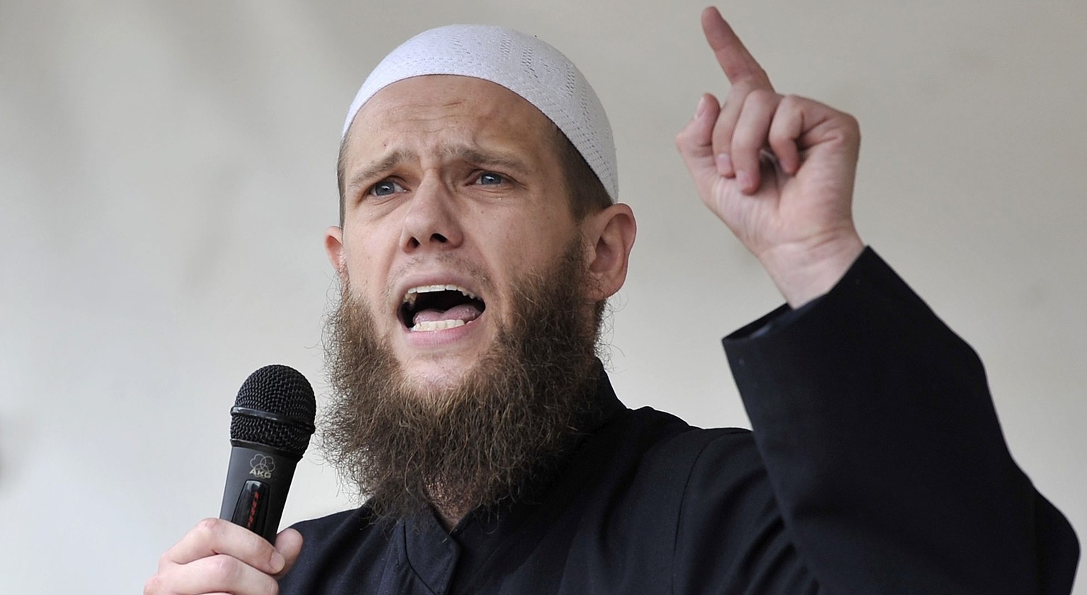 epa05397757 (FILE) A file photograph shows Islamist preacher Sven Lau, also known as Abu Adam, speaking during a Salafist event in Cologne, Germany, 09 June 2012. The Duesseldorf Higher Regional Court ...