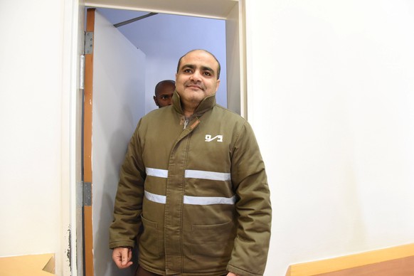 Palestinian Mohammad El Halabi (C), a manager of operations in the Gaza Strip for U.S.-based Christian charity World Vision, accused by Israel of funnelling millions of dollars in aid money to Hamas i ...