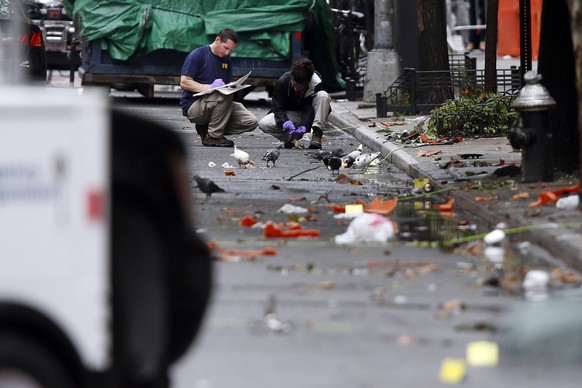 Evidence teams investigate at the scene of Saturday&#039;s explosion on West 23rd Street in Manhattan&#039;s Chelsea neighborhood, Monday, Sept. 19, 2016, in New York. Ahmad Khan Rahami, wanted in the ...
