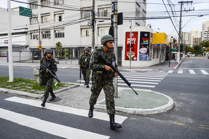 epaselect epa05775545 Members of the Brazilian army patrol the streets of Vitoria, Espirito Santo State, Brazil, 06 February 2017. The capital of the southeastern Brazilian state of Espirito Santo has ...