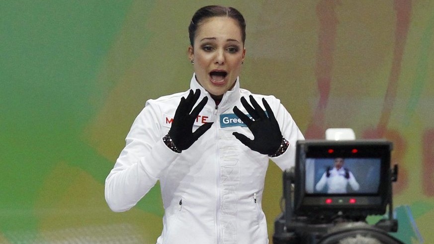 Sarah Meier from Switzerland, left, reacts next to her coach Evi Fehr upon realizing her victory in the ladies free skating at the ISU European Figure Skating Championships in the Postfinance Arena in ...