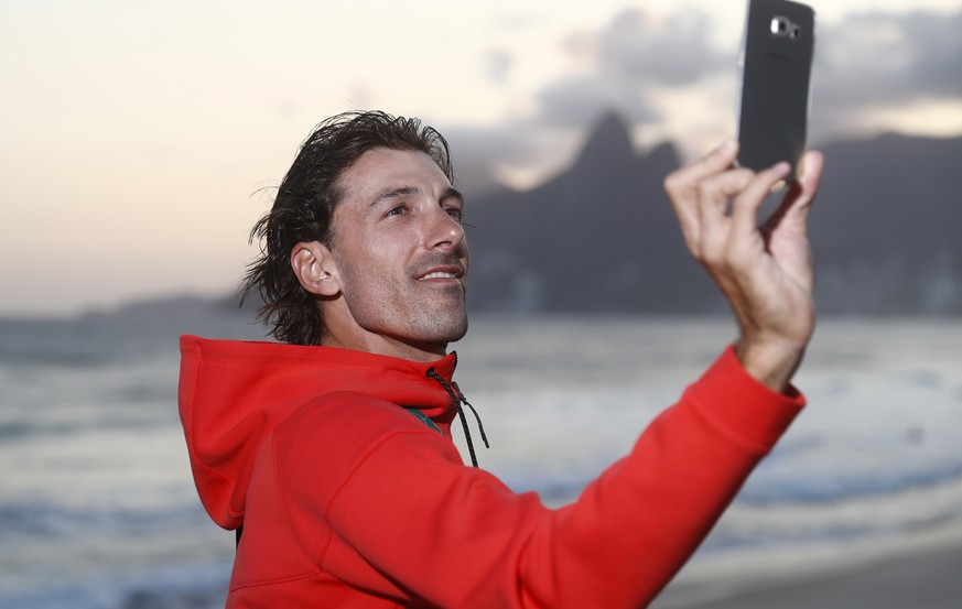 Swiss cycling athlete Fabian Cancellara takes a selfie picture in front of Ipanema beach prior to a media conference of the Swiss cycling team prior to the Rio 2016 Olympic Summer Games at the TV-Stud ...