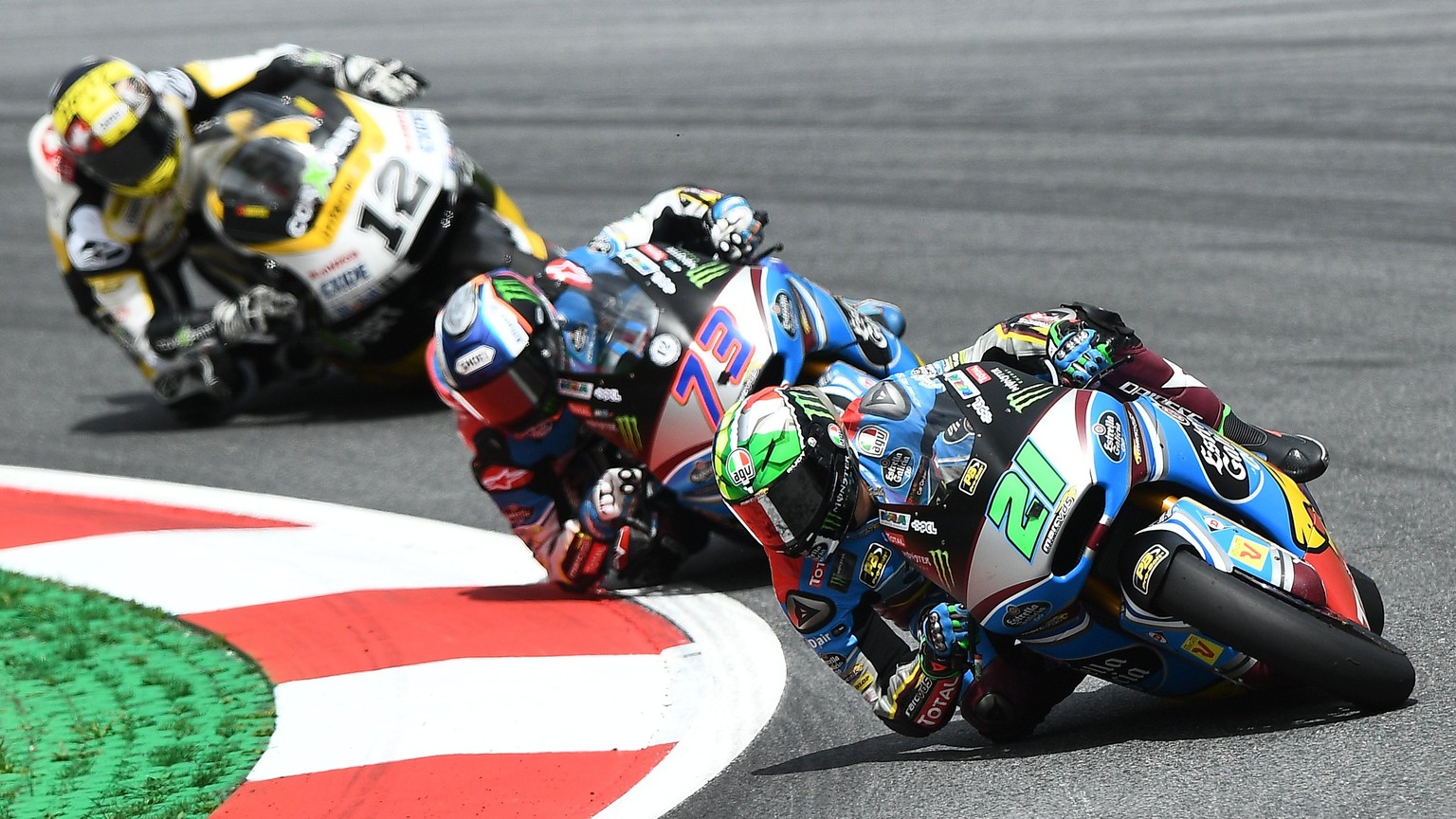 epa06141834 Italian Moto2 rider Franco Morbidelli of the EG 0,0 Marc VDS team (R) leads in front of Spaniard Alex Marquez of EG 0,0 Marc VDS Team (C) and Swiss Thomas Luthi of CarXpert Interwetten Tea ...