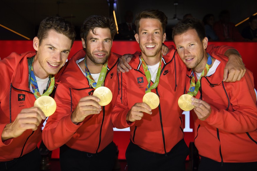 From left, Lucas Tramer, Mario Gyr, Simon Schuerch, Simon Niepmann and Mario Gyr of Switzerland pose with their gold medal after winning in the Lightweight-Four during a medal celbration in the House  ...