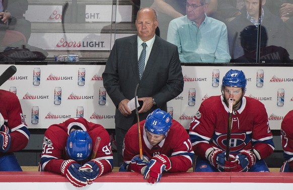 Montreal Canadiens head coach Claude Julien and players Jonathan Drouin (92), Brendan Gallagher (11) and Alex Galchenyuk (27) look on from the bench during the third period of an NHL hockey game again ...