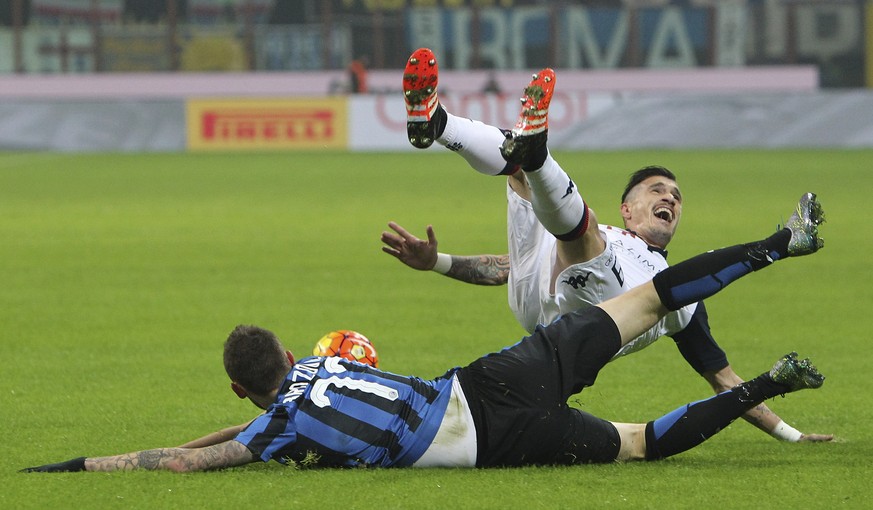 MILAN, ITALY - DECEMBER 15: Marcelo Brozovic (down) of FC Internazionale Milano clashes with Fabio Pisacane (up) of Cagliari Calcio during the TIM Cup match between FC Internazionale Milano and Caglia ...