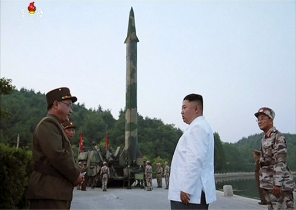This image made from video of an undated still image broadcasted in a news bulletin on Tuesday, May 30, 2017, by North Korea&#039;s KRT shows North Korean leader Kim Jong Un and a missile launcher in  ...
