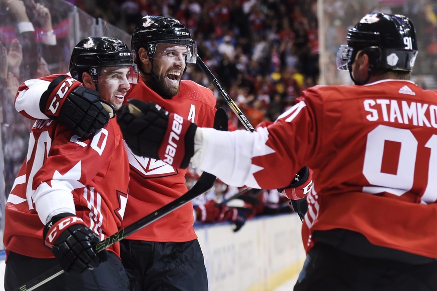Team Canada&#039;s John Tavares (20) celebrates his goal against Team Russia with teammates Shea Weber (6) and Steven Stamkos (91) during the third period of a World Cup of Hockey semifinal game, Satu ...