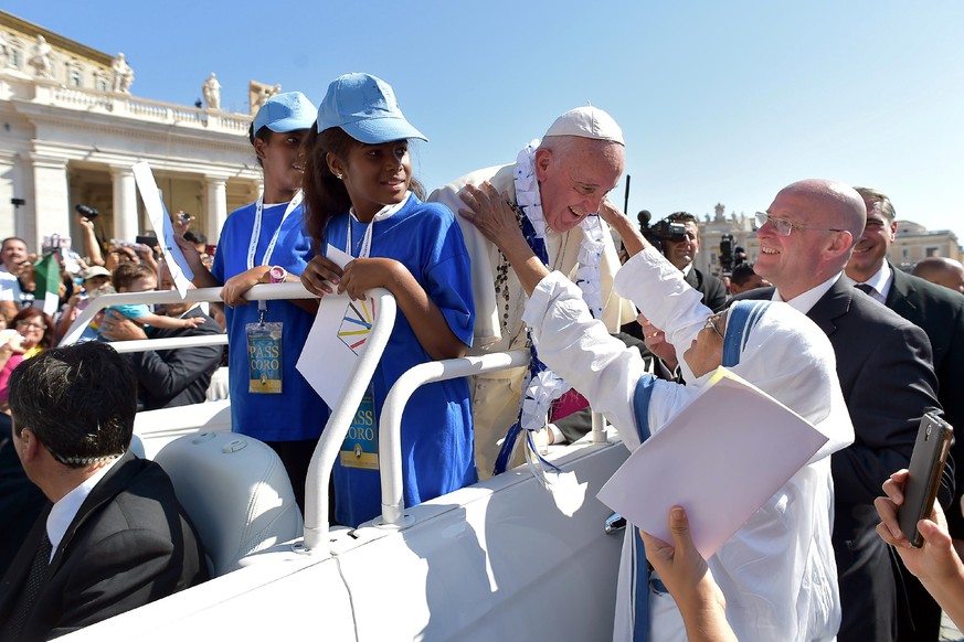 A Missionaries of Charity nun greets Pope Francis upon his arrival in St. Peter&#039;s Square at the Vatican for a jubilee audience for workers and volunteers of mercy, Saturday, Sept. 3, 2016. The sq ...