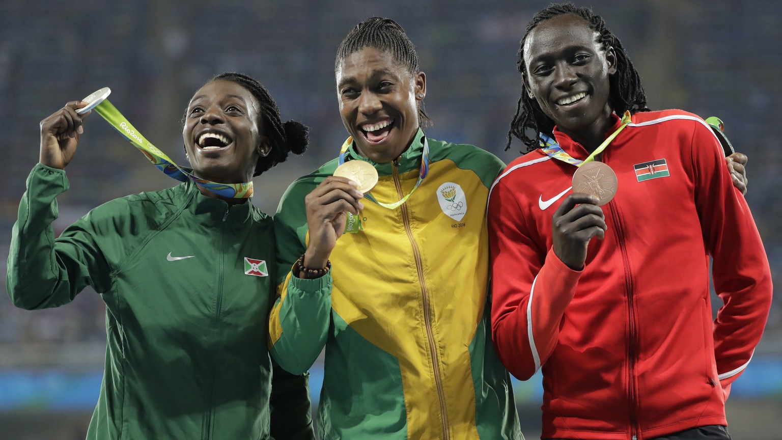 Medalist in the women&#039;s 800 meters, from left, Burundi&#039;s Francine Niyonsaba, silver, South Africa&#039;s Caster Semenya, gold, and Kenya&#039;s Margaret Wambui, bronze, hold their medals dur ...