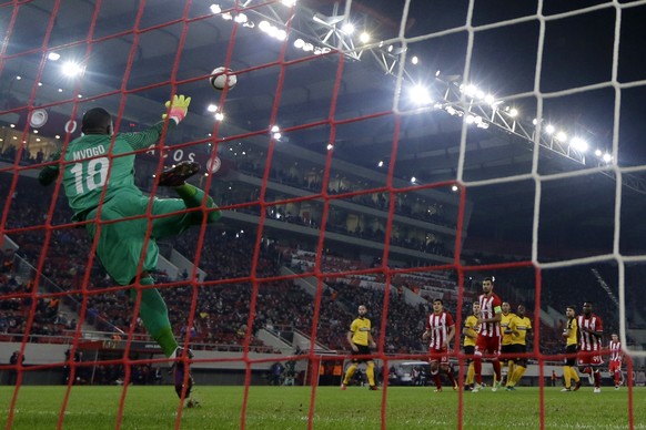 Young Boys&#039; goalkeeper Yvon Mvogo receives a goal during the Europa League Group B soccer match between Olympiakos and Young Boys at Georgios Karaiskakis stadium in Piraeus port, near Athens, Thu ...