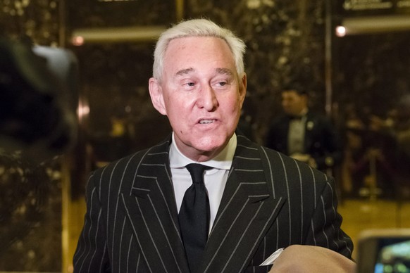 epa05663029 Conservative lobbyist and consultant Roger Stone speaks with the press in the lobby of Trump Tower in New York, NY, USA, 06 December 2016. US President-elect Donald Trump is holding meetin ...