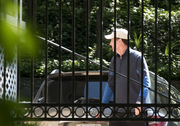 Former FBI Director James Comey walks at his home in McLean, Va., Wednesday, May 10, 2017. President Donald Trump fired Comey on Tuesday, ousting the nation&#039;s top law enforcement official in the  ...