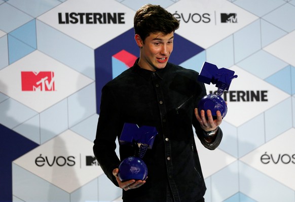 Canadian singer Shawn Mendes poses with his trophies during the 2016 MTV Europe Music Awards at the Ahoy Arena in Rotterdam, Netherlands, November 6, 2016. REUTERS/Michael Kooren