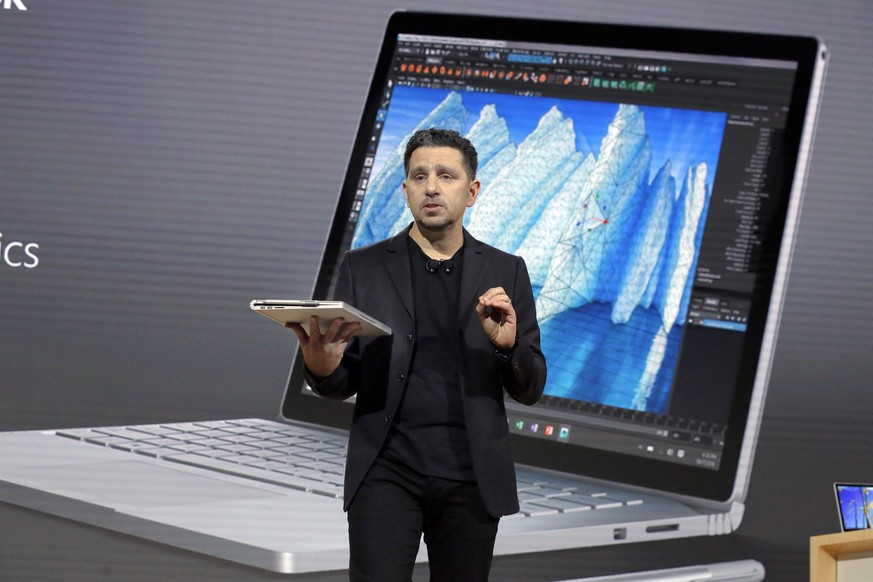 CORRECTS DEVICE TO SURFACE BOOK, NOT SURFACE PRO 7 - Panos Panay, corporate vice president for Surface Computing at Microsoft Corp., displays the Surface Book during the company&#039;s media event in  ...