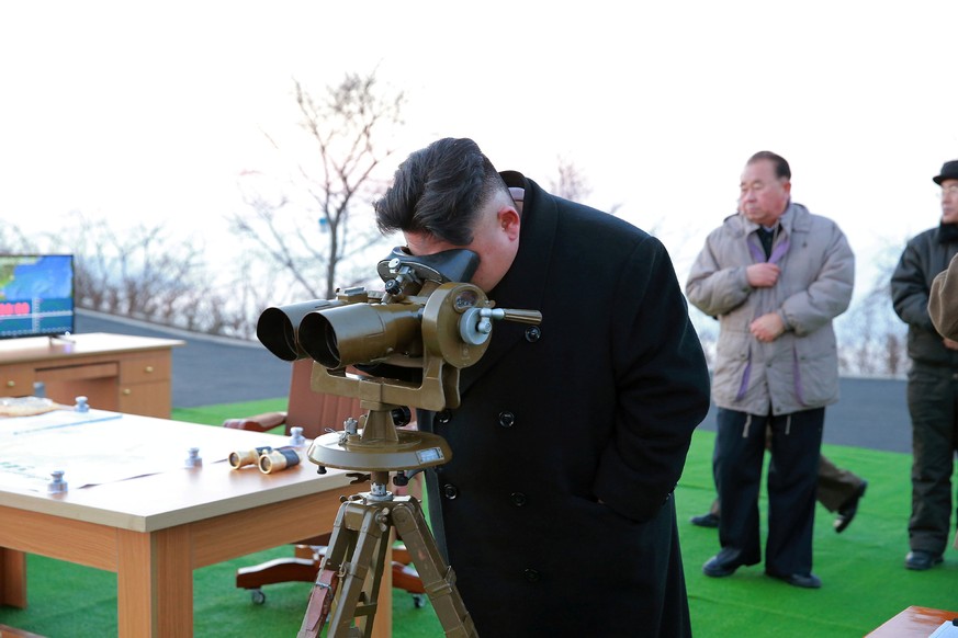 North Korean leader Kim Jong Un supervised a ballistic rocket launching drill of Hwasong artillery units of the Strategic Force of the KPA on the spot in this undated photo released by North Korea&#03 ...