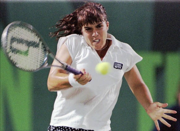 Jennifer Capriati of Wesley Chapel, Florida, returns a serve by Venus Williams of Palm Beach, Florida, during third round action at the Lipton Championship being played in Key Biscayne, Florida, Satur ...