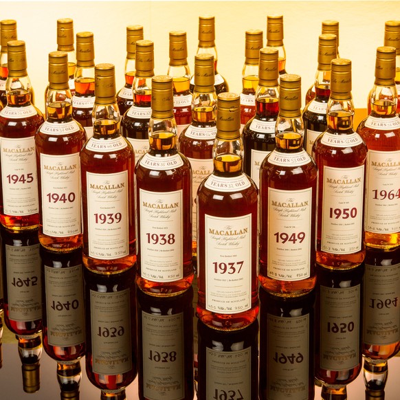 IMAGE DISTRIBUTED FOR ZACHYS - In this photo released on Tuesday, Aug. 26, 2014, a collection of Macallan Fine and Rare Single Malt Scotch spanning vintages 1937-1972 is prepared for the Zachys Septem ...