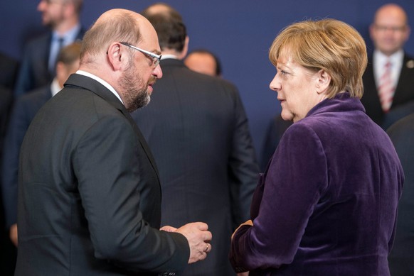 epa05746965 (FILE) - The file picture dated 17 December 2015 shows then President of the European Parliament Martin Schulz (L) and German Chancellor Angela Merkel (R) at the start of an EU Summit in B ...