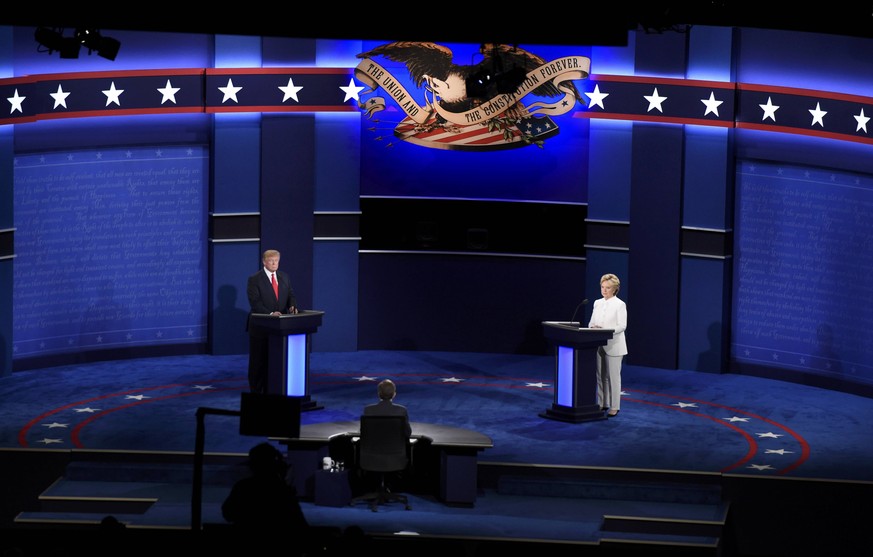 Republican U.S. presidential nominee Donald Trump and Democratic nominee Hillary Clinton begin their third and final 2016 presidential campaign debate at UNLV in Las Vegas, Nevada, U.S., October 19, 2 ...