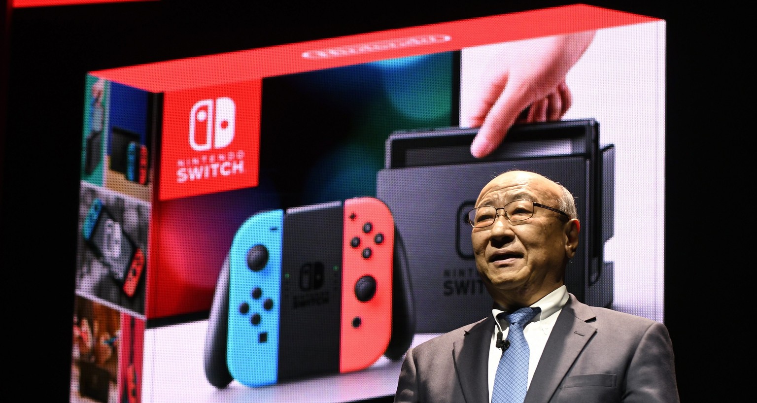 epa05714142 Nintendo President Tatsumi Kimishima presents the company&#039;s new gaming console, the Nintendo Switch, during the Nintendo Switch Presentation 2017 in Tokyo, Japan, 13 January 2017. The ...