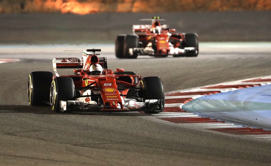 Ferrari driver Sebastian Vettel of Germany steers his car during the Bahrain Formula One Grand Prix, at the Formula One Bahrain International Circuit in Sakhir, Bahrain, Sunday, April 16, 2017. (AP Ph ...