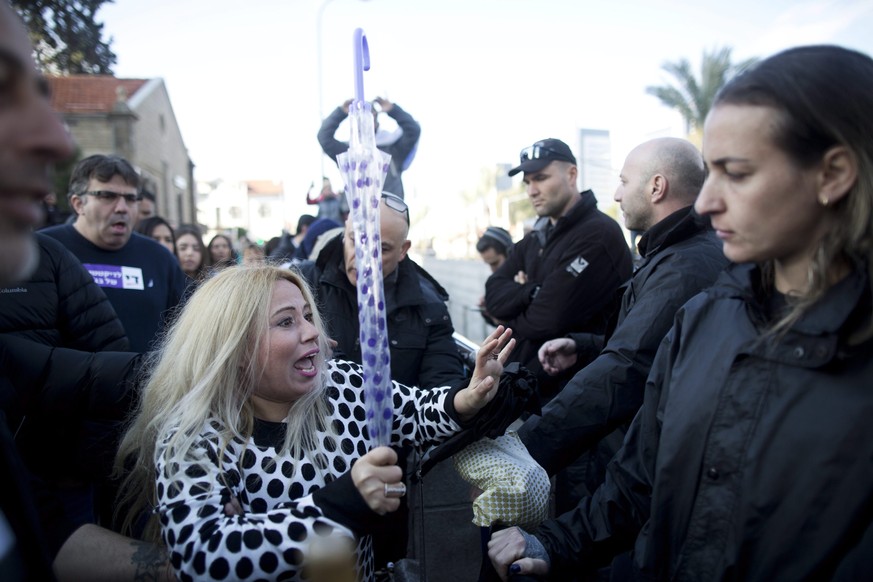 epa05697549 Israeli police confront with right-wing supporters after the verdict against Israeli Sergeant Elor Azaria, who was convicted over the shooting and killing of a Palestinian man, outside the ...