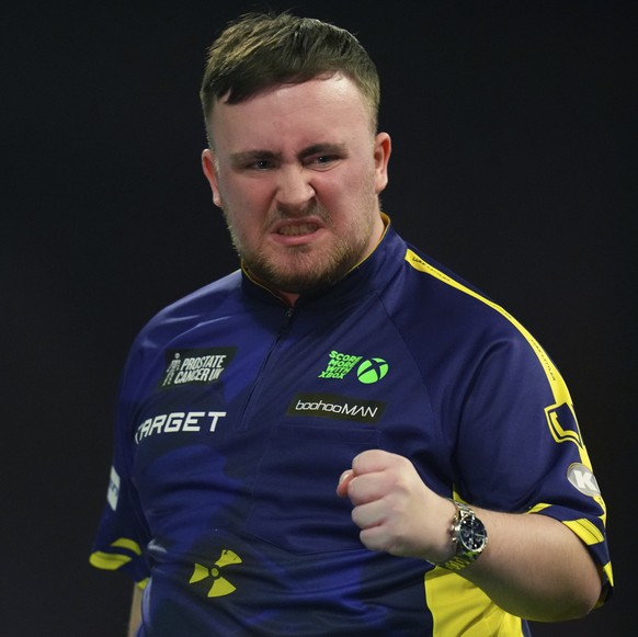 Nachrichten Linkding Luke Littler of England reacts during the semifinal match against Stephen Bunting of England, at the World Darts Championship in London, Thursday, Jan. 2, 2025. (AP Photo/Kirsty Wigglesworth)