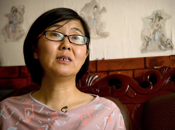 FILE - In this April 18, 2015 file photo, Wang Yu, a lawyer for Chinese activist Li Tingting, speaks during an interview in Beijing. China released the prominent human rights lawyer on bail amid prote ...