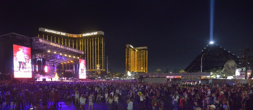 epa06239552 A handout photo made available by the Las Vegas News Bureau on 02 October showing the scene at the Route 91 Harvest festival on Las Vegas Boulevard South in Las Vegas 30 September, 2017. R ...