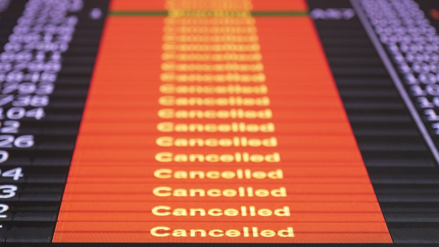 epa10013983 A display shows canceled flights at Zurich Airport in Zuris¡ch, Switzerland, 15 June 2022. Flights resumed over Switzerland after the airspace had been closed in the early morning hours fo ...