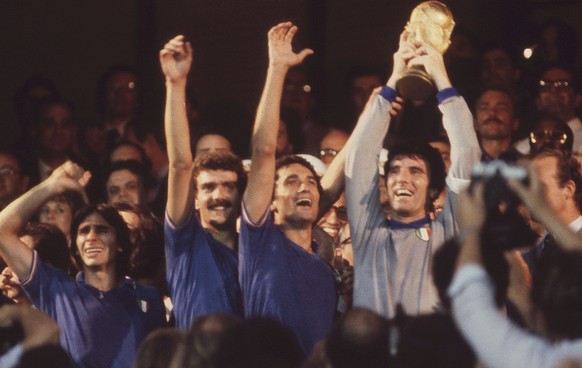 FILE - The July 11, 1982 file photo shows Italian captain and goalkeeper Dino Zoff, right, holding the World Cup trophy aloft,after the presentation ceremony, in Santiago Bernabea Stadium, Madrid. Ita ...