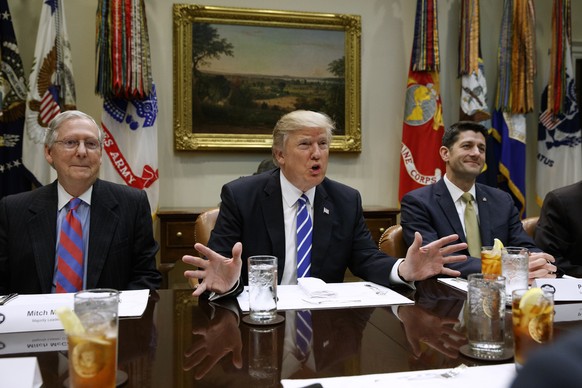 FILE - In this March 1, 2017, file photo President Donald Trump, flanked by Senate Majority Leader Mitch McConnell of Ky., left, and House Speaker Paul Ryan of Wis., speaks in the Roosevelt Room of th ...